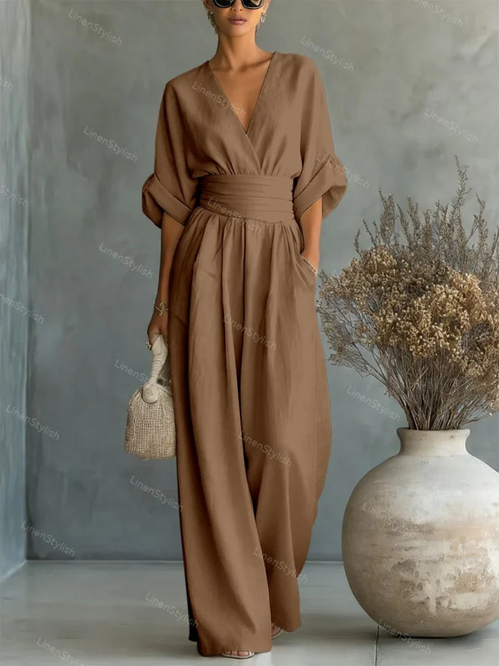 Tuta donna con cintura, scollo V, maniche kimono. Crea un look serale elegante e moderno.