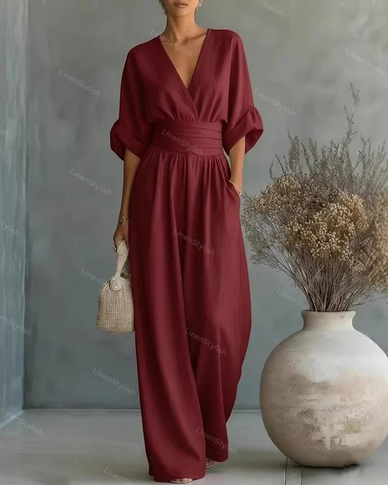 Tuta intera donna fluida, scollo a V e maniche kimono. Ideale per eventi formali e serate eleganti.