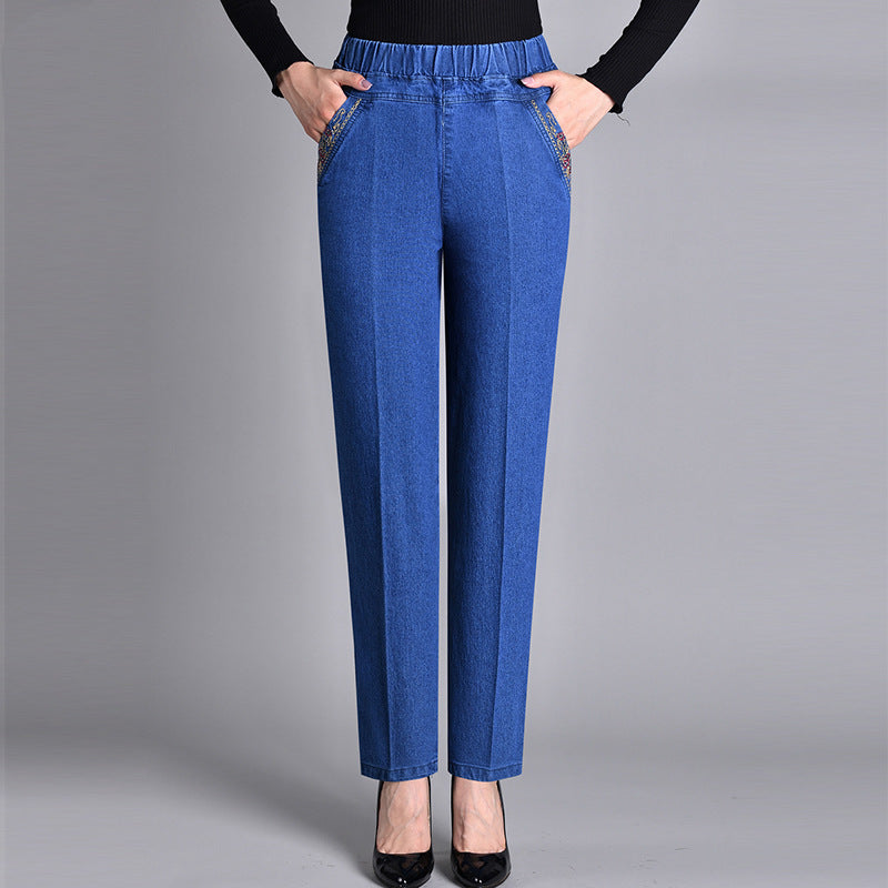 Jeans dritti donna blu eleganti con vita elastica e tasche, perfetti per look casual chic e comodi.