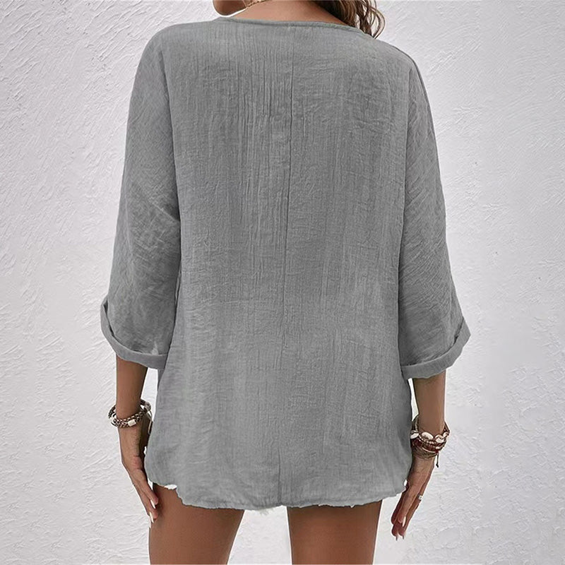 Camicia donna con bottoni frontali, scollo a V. Top a maniche lunghe, perfetto per uno stile casual ricercato.
