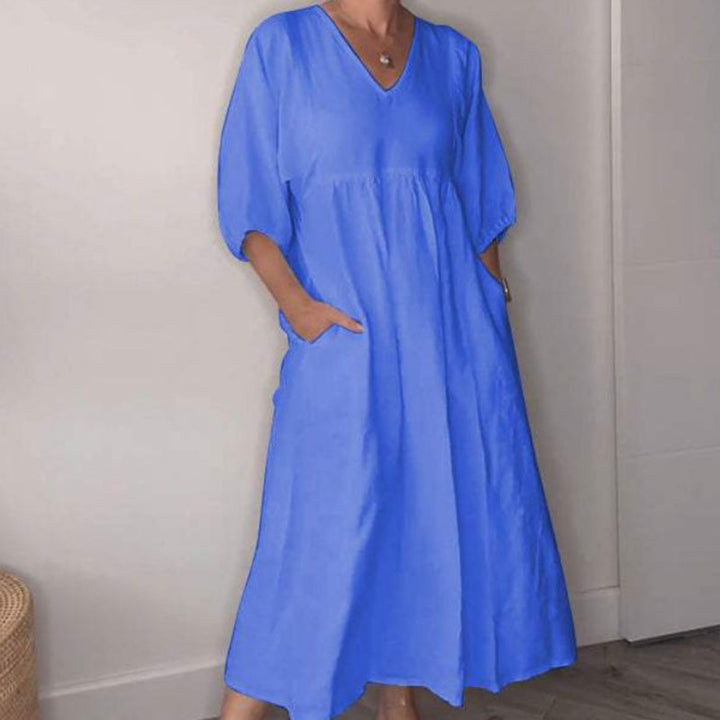 Abito midi donna con scollo a V, vestito fluido e confortevole per un look estivo chic e senza sforzo.