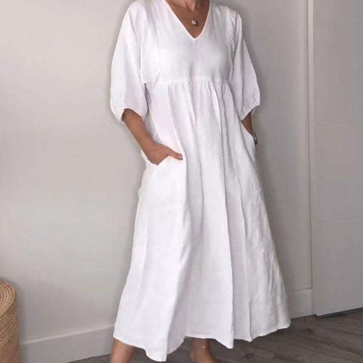 Vestito midi donna fluido con scollo a V, un capo confortevole e chic per il tuo stile estivo quotidiano.