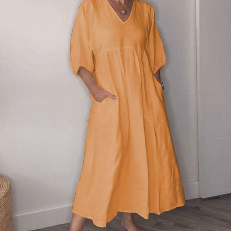 Vestito midi donna fluido, scollo a V, design elegante e confortevole, ideale per un look casual estivo chic.