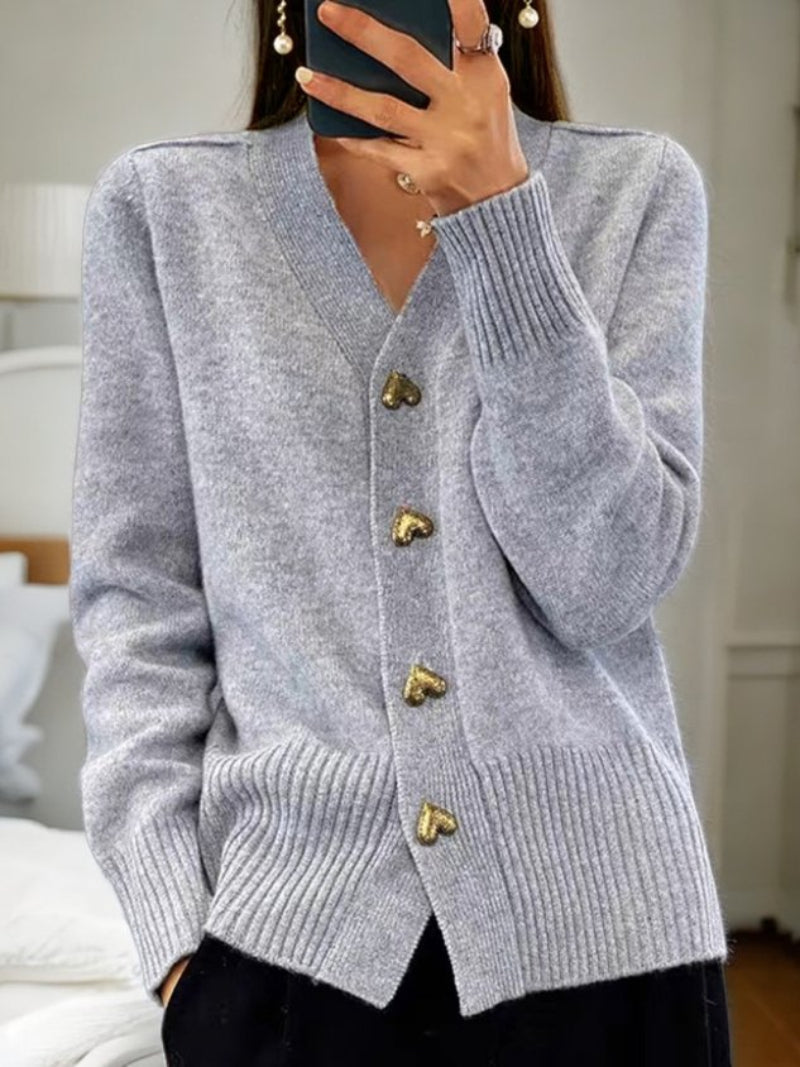 Cardigan donna moda autunnale, tinta unita con bottoni e scollo a V. Maniche lunghe, stile casual-elegante.