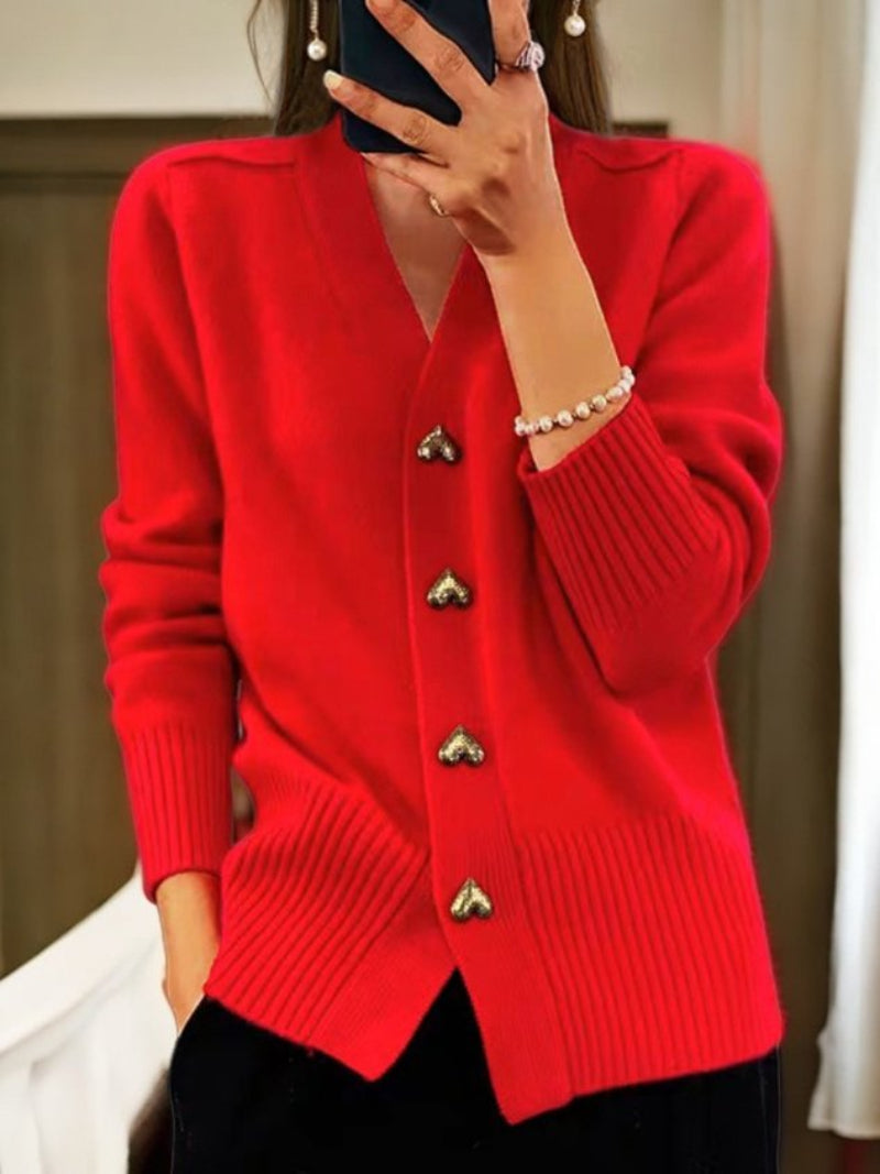 Cardigan donna a tinta unita con maniche lunghe e chiusura a bottoni. Stile versatile per l'autunno/inverno.