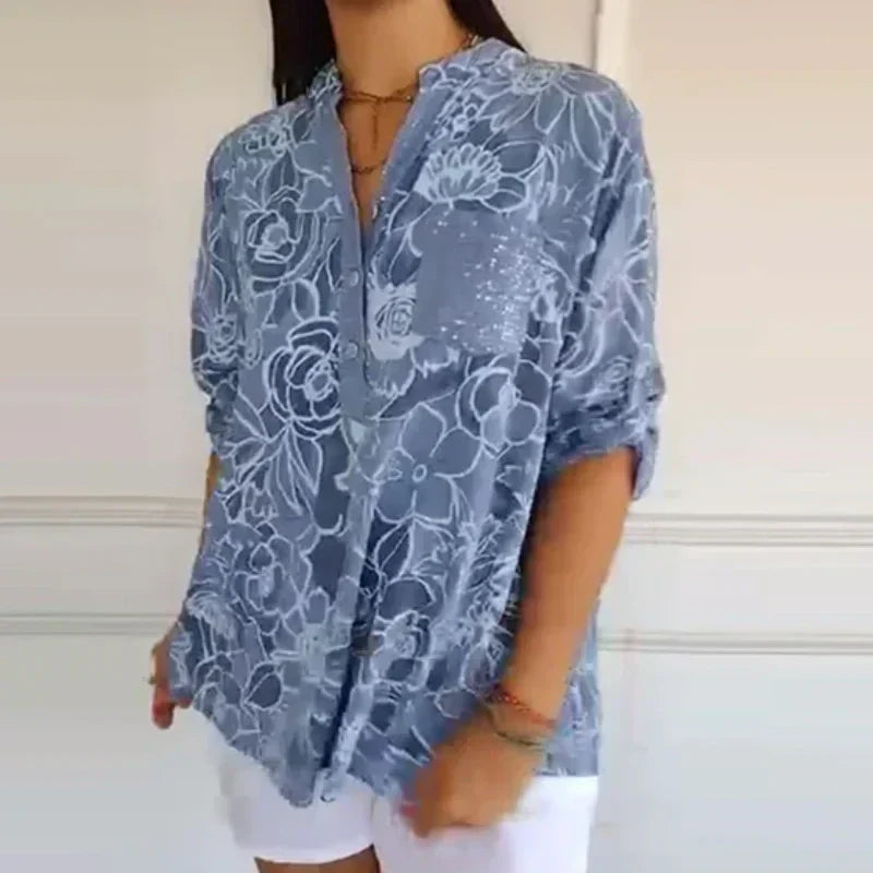 Camicetta donna elegante a maniche lunghe con delicata stampa floreale, perfetta per primavera/estate.