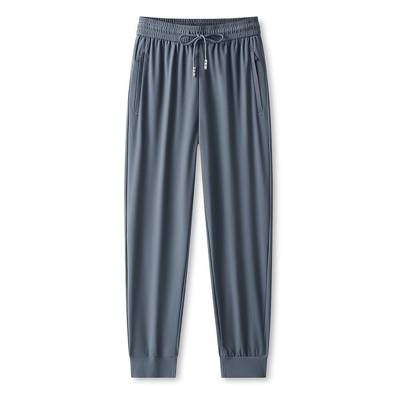 Pantaloni jogging da uomo versatili per sport, viaggio e relax. Massima comodità, tessuto traspirante e rapida asciugatura.