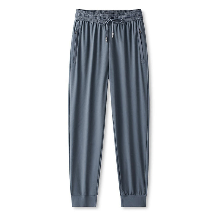 Pantaloni jogging da uomo versatili per sport, viaggio e relax. Massima comodità, tessuto traspirante e rapida asciugatura.