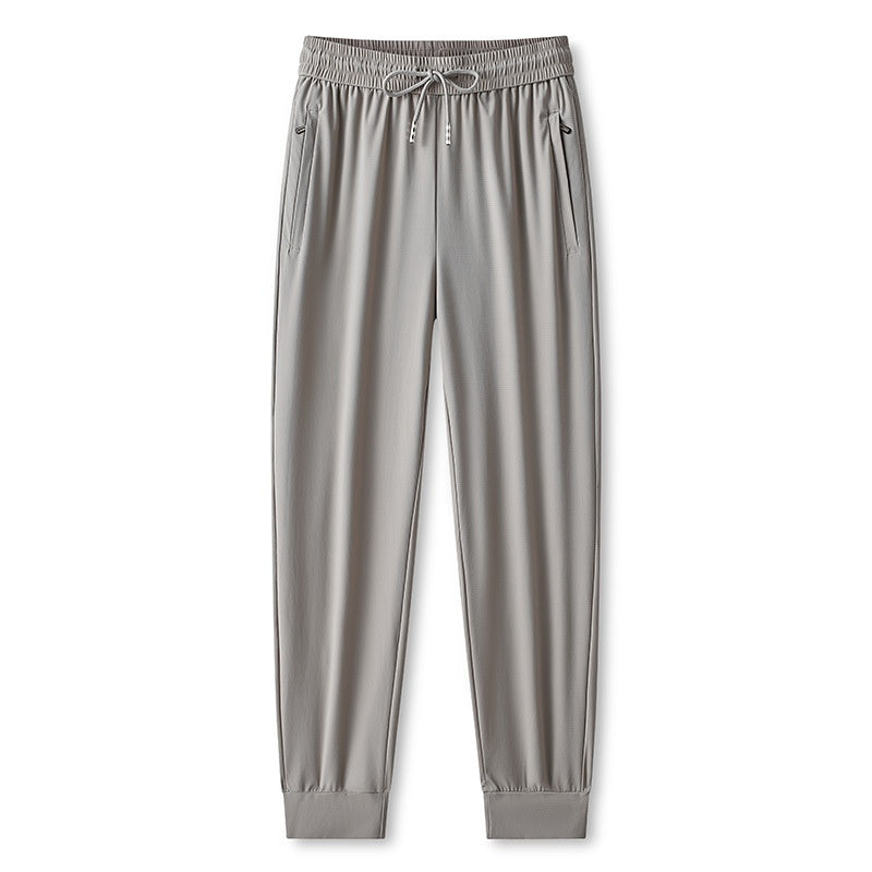 Pantaloni allenamento uomo, leggeri e ad asciugatura rapida. Perfetti per il jogging e lo sport quotidiano.