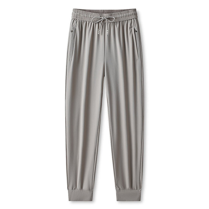Pantaloni allenamento uomo, leggeri e ad asciugatura rapida. Perfetti per il jogging e lo sport quotidiano.