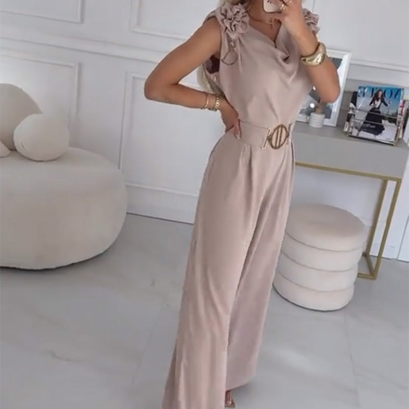 Abbigliamento donna: tuta kaki senza maniche con applicazione di fiori 3D e cintura, per un outfit chic.