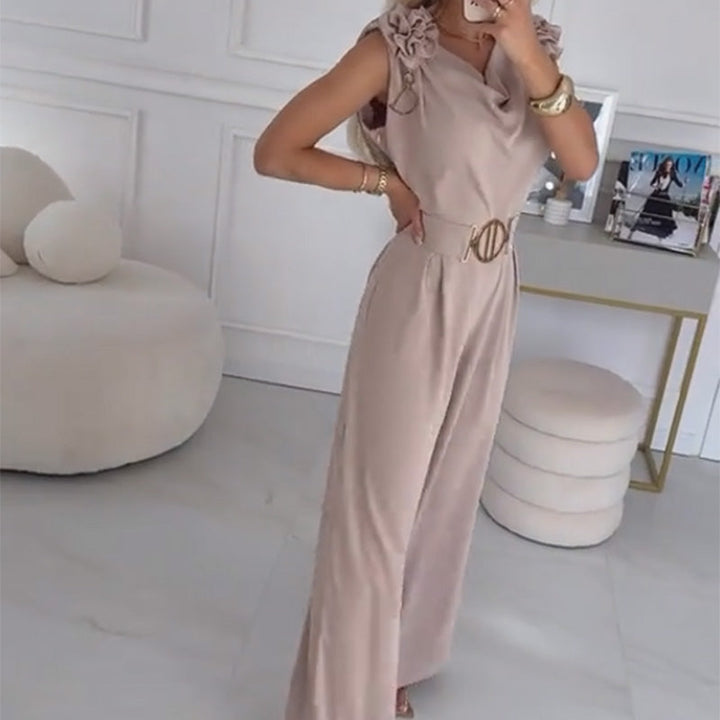 Abbigliamento donna: tuta kaki senza maniche con applicazione di fiori 3D e cintura, per un outfit chic.
