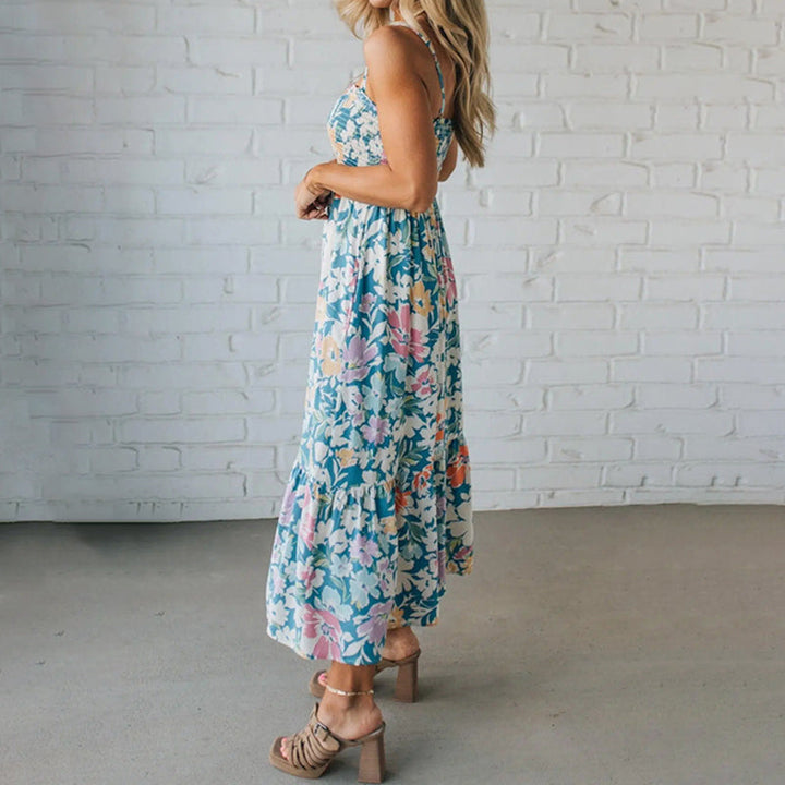 Abito midi floreale da donna con spalline sottili, svolazzante e leggero per passeggiate estive o garden party.