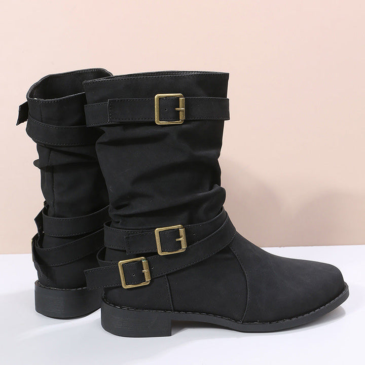 Stivaletti autunnali da donna con fibbia decorativa. Nero, tacco basso e suola robusta. Versatili e alla moda.