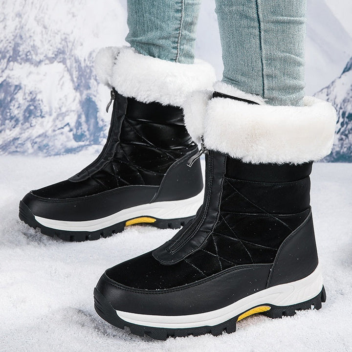 Stivali invernali da donna con zip, ideali per la neve. Suola antiscivolo per sicurezza e comfort.