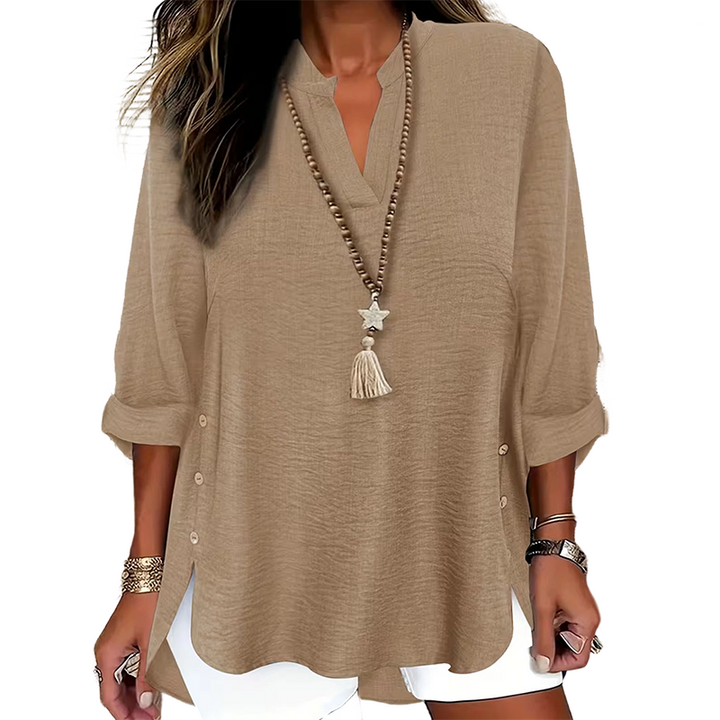 Top donna elegante con scollo a V e bottoni laterali, perfetto per primavera/estate.