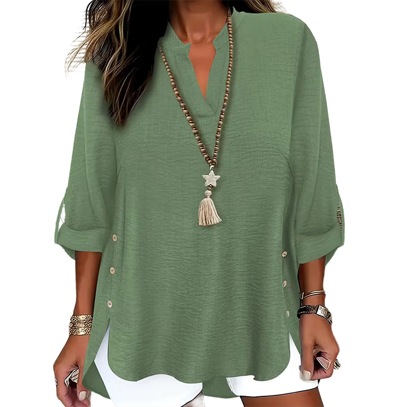 Top donna primaverile con scollo a V, dettagli bottoni laterali, per un outfit raffinato.