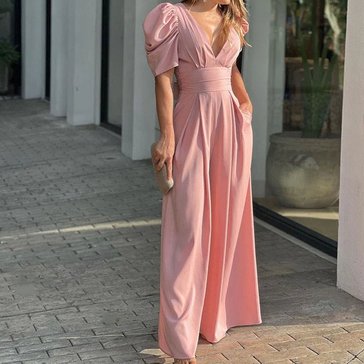 Tuta donna stile palazzo, scollo a V, linea fluida, ideale per eventi estivi e serate speciali.