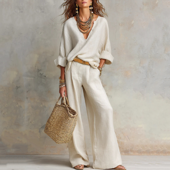 Completo donna elegante casual in effetto lino, pantaloni palazzo e top, perfetto per comfort estivo.