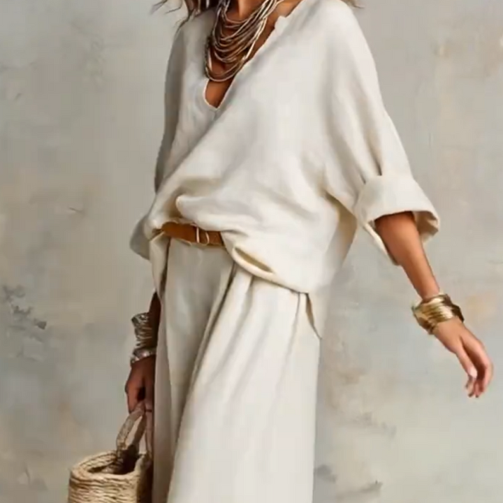 Pantaloni palazzo ampi effetto lino e top scollo a V, completo estivo donna resort wear confortevole.