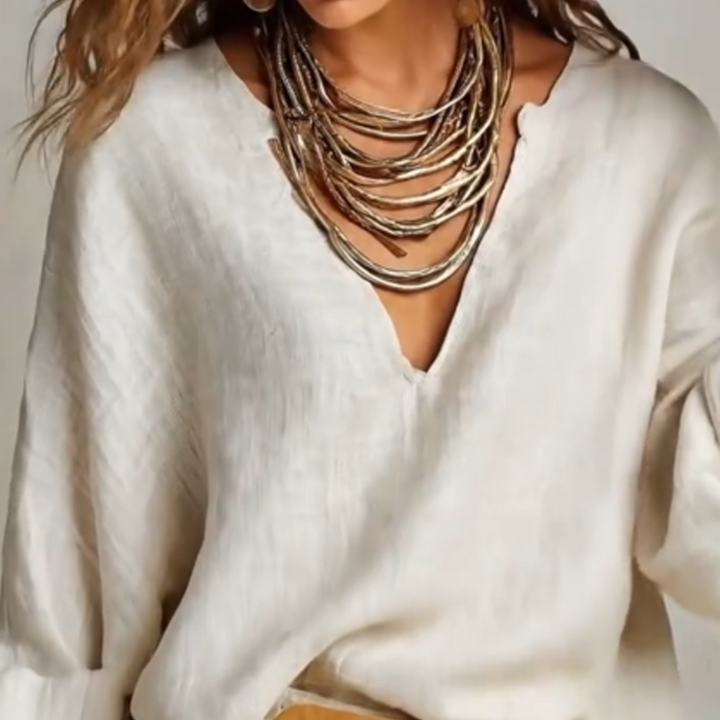 Completo donna estivo casual chic con pantaloni palazzo e top scollo a V effetto lino per moda mare.