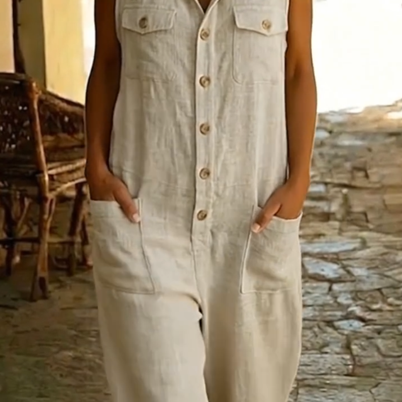 Versatile tuta donna smanicata in misto lino, con bottoni frontali, per un outfit estivo casual-chic.
