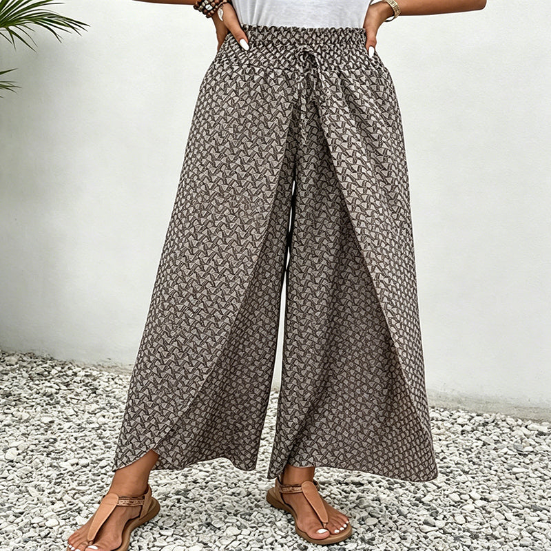 Pantaloni palazzo da donna floreali con vita arricciata. Stile casual ed elegante per l'estate.