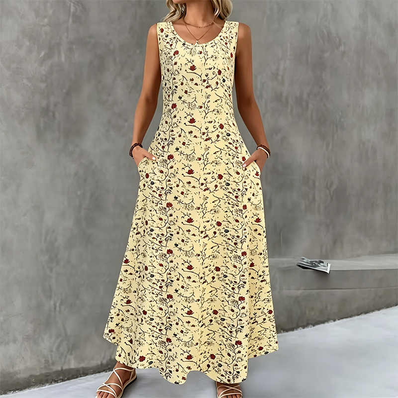 Abito lungo casual da donna con fantasia estiva e tasche laterali, perfetto per il tempo libero.