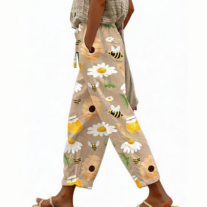 Pantaloni estivi floreali da donna, vita elastica regolabile, tessuto leggero per massimo comfort.