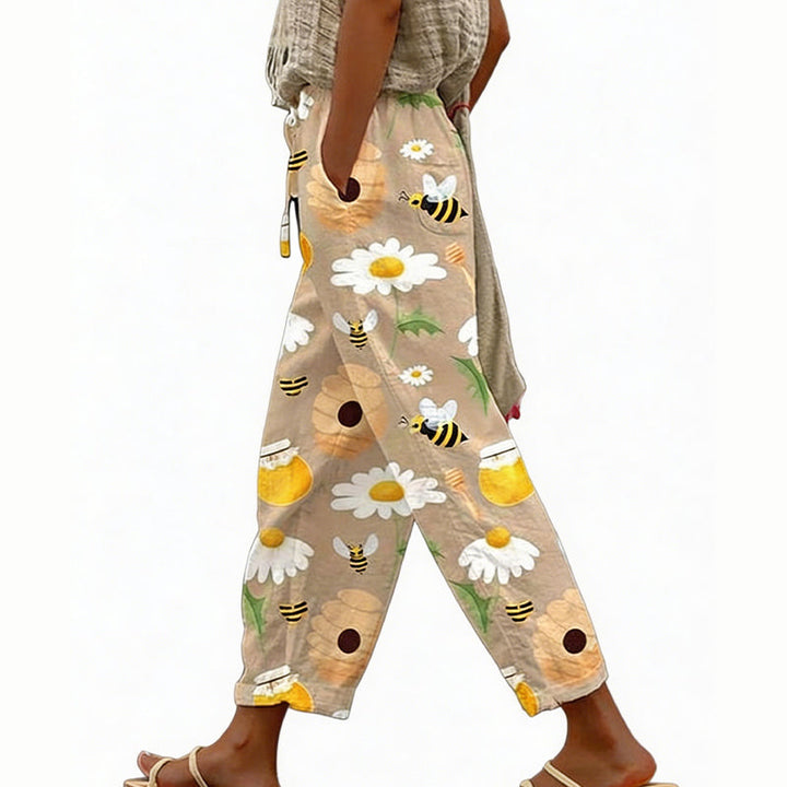 Pantaloni estivi floreali da donna, vita elastica regolabile, tessuto leggero per massimo comfort.