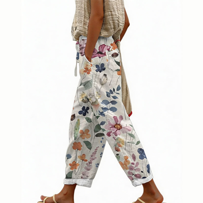 Pantaloni da donna estivi con motivo floreale, vita regolabile, ampi e confortevoli per le vacanze.