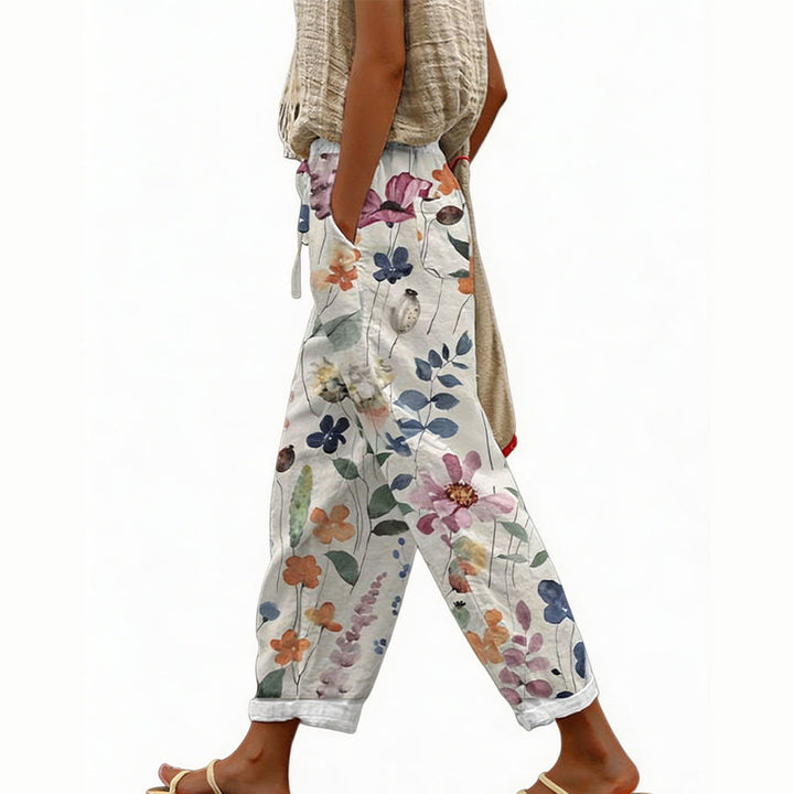 Pantaloni da donna estivi con motivo floreale, vita regolabile, ampi e confortevoli per le vacanze.