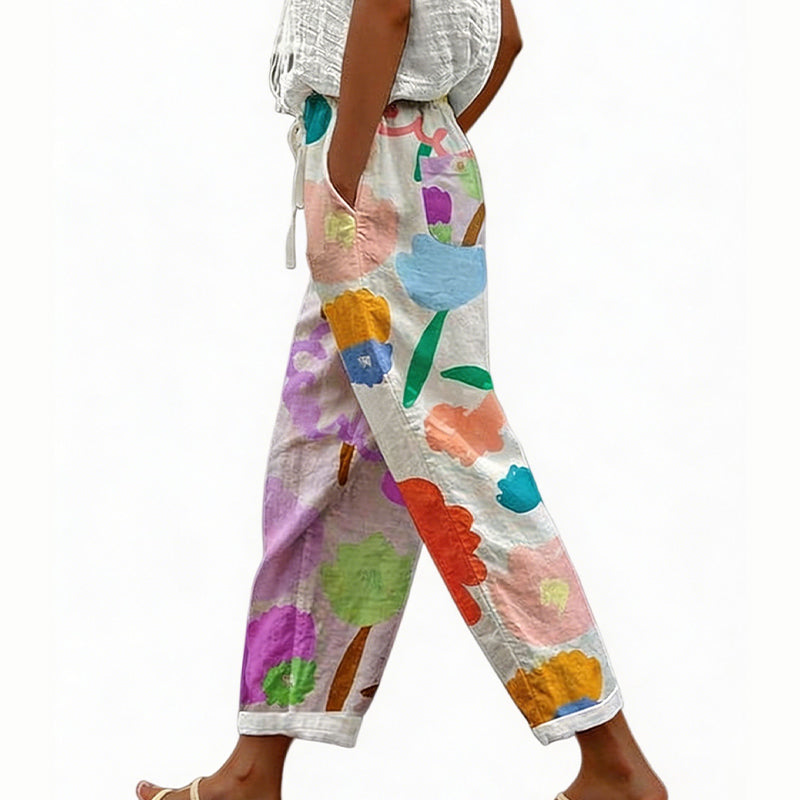 Pantaloni donna casual floreali, ideali per l'estate, comodi per spiaggia e tempo libero.