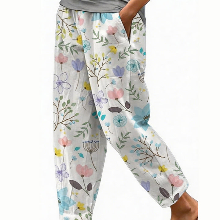 Pantaloni casual ampi da donna, fantasia floreale, leggeri per spiaggia e passeggiate estive.
