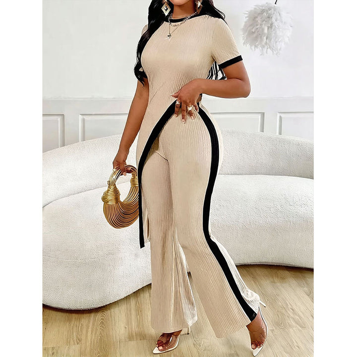Completo donna elegante con pantaloni a zampa e top asimmetrico in poliestere a coste, ideale primavera/estate.