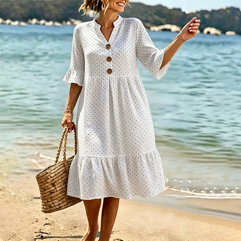 Chic abito midi donna estivo a pois con orlo a volant, per un tocco casual-elegante.