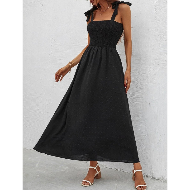Vestito donna lungo con motivo floreale vivace e spalline sottili regolabili per una vestibilità perfetta.