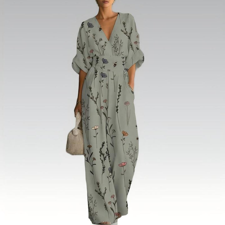 Tuta floreale elegante donna, scollo a V. Abbigliamento estivo versatile, gamba ampia, comfort e stile femminile.