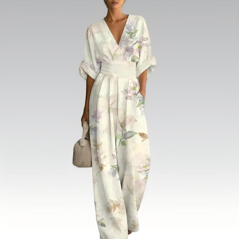 Tuta elegante floreale colorata da donna con scollo a V, perfetta per la moda estiva e cene sofisticate.