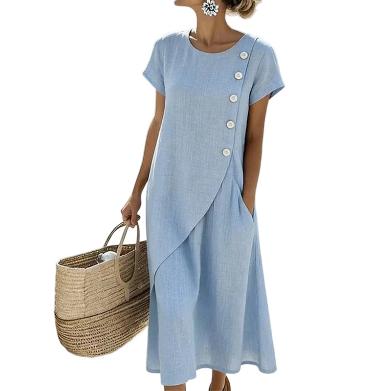 Abito midi donna in cotone lino con design unico a bottoni asimmetrici. Look estivo versatile ed elegante.
