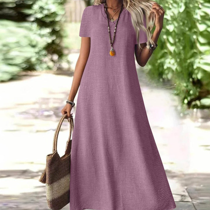 Abito maxi donna, vestito estivo lungo, scollo a V, tasche. Eleganza e comfort per la moda casual estiva.
