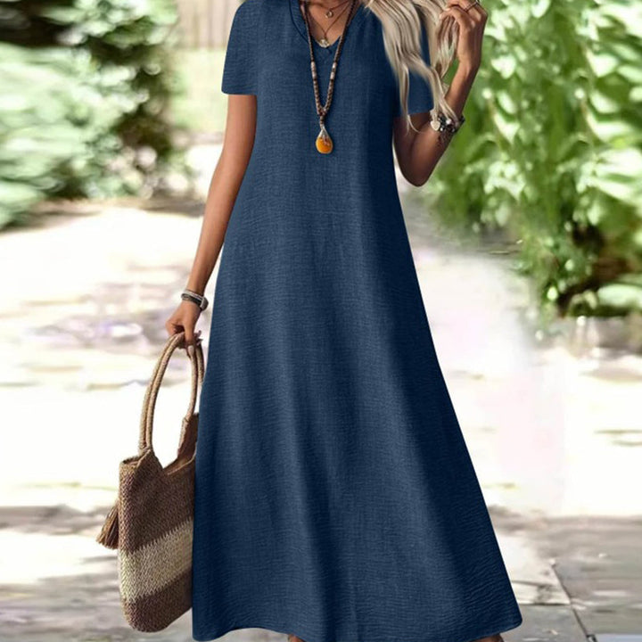 Abito lungo donna elegante, scollo a V e tasche. Ideale per serate estive o eventi casual chic. Vestito maxi.