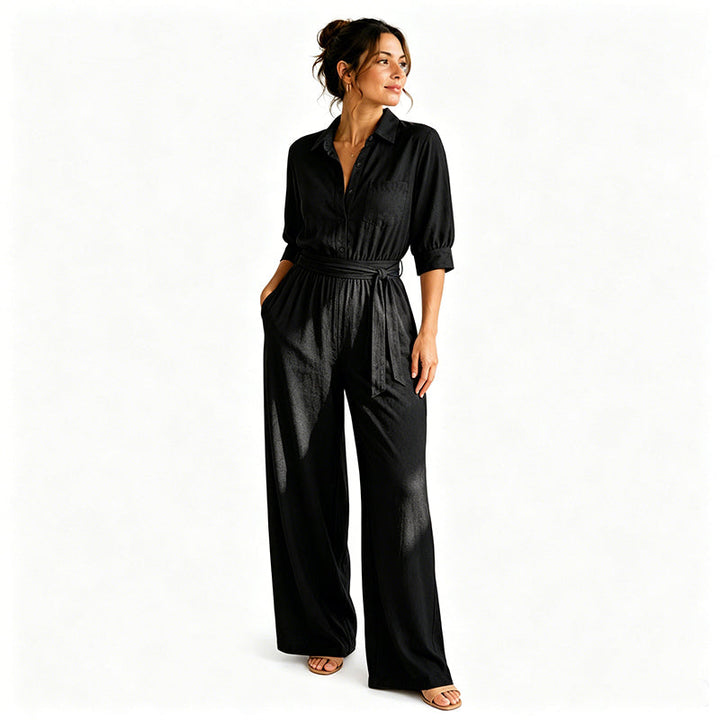Tuta elegante donna con pantaloni a palazzo e cintura. Look raffinato per serate o eventi speciali.