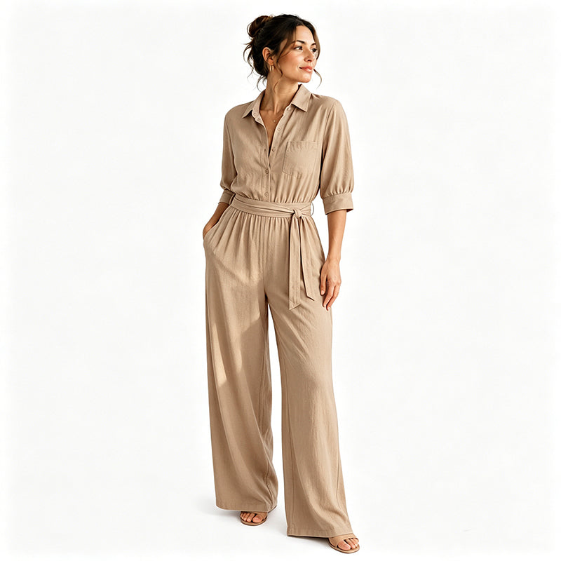 Tuta donna elegante con pantaloni ampi e tessuto fluttuante. Cintura abbinata per outfit primavera estate.