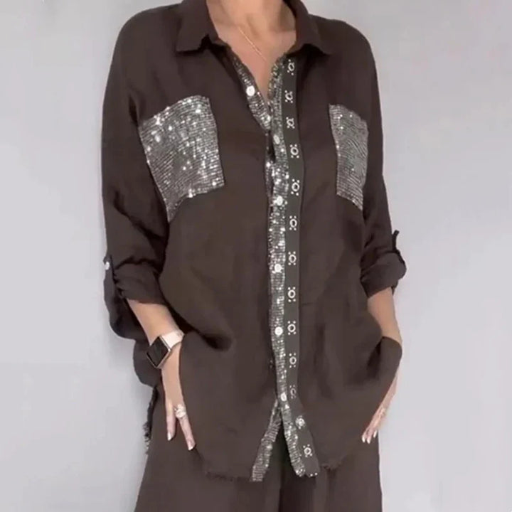 Abbigliamento donna: completo elegante con top paillettes e pantaloni fluidi. Stile e comfort garantiti.