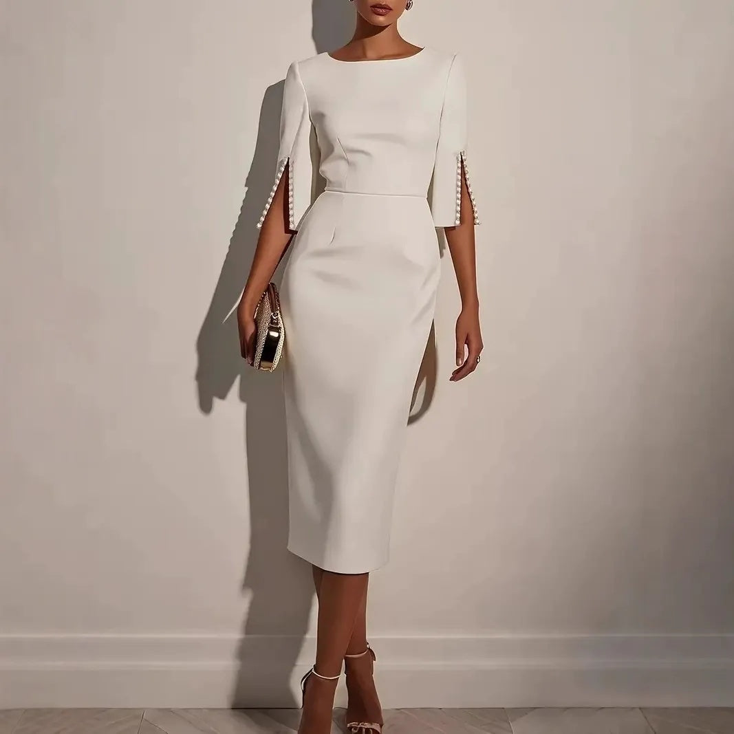 Abito tubino midi elegante da donna, con maniche spaccate, ideale per cerimonie e serate speciali.