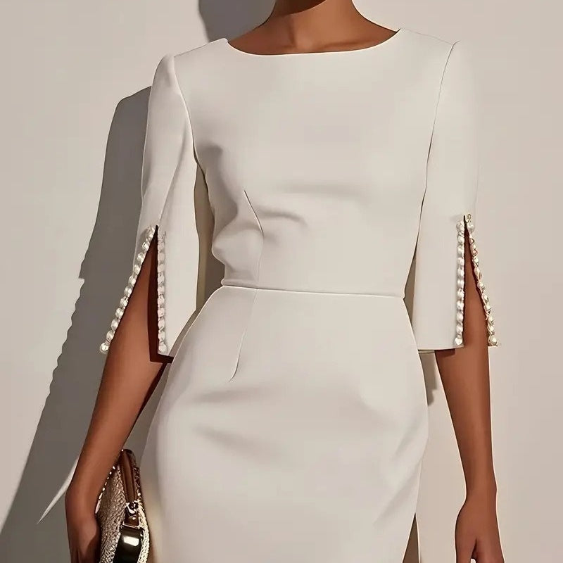 Tubino midi nero donna elegante, con maniche spaccate, versatile per look da sera e eventi chic.