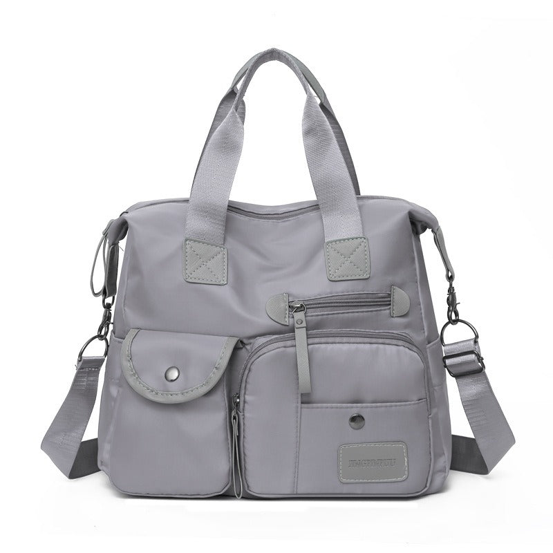 Borsa tote donna versatile, impermeabile, capiente e con numerose tasche, per una vita attiva e organizzata.