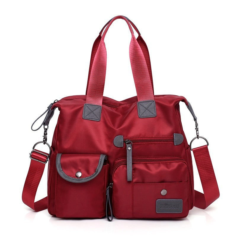 Borsa tote donna pratica, impermeabile e spaziosa, accessorio indispensabile per ogni occasione.