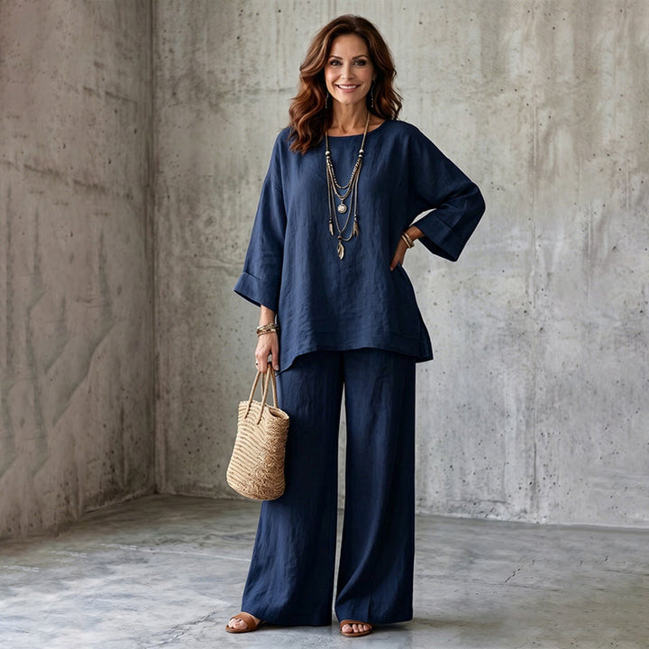 Outfit casual chic donna: completo due pezzi con pantaloni larghi e blusa leggera per l'estate.